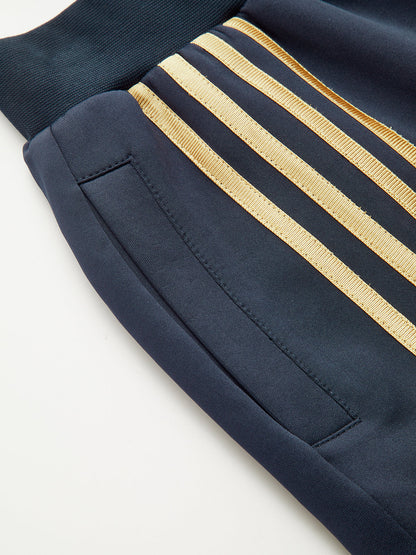 Quadruple Stripe Sweatpants