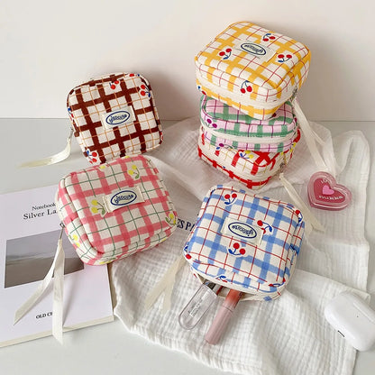 Korean version of large plaid cosmetic bag high value small cherry sanitary napkin portable mini storage bag bluetooth headset b