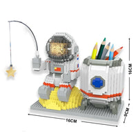 Astronaut pen holder