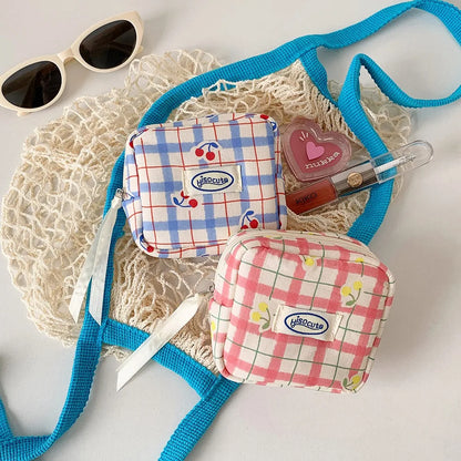 Korean version of large plaid cosmetic bag high value small cherry sanitary napkin portable mini storage bag bluetooth headset b