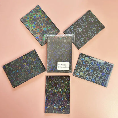 50pcs/lot 61*91mm Heart Love Laser Flashing Card Sleeves Protector For Photo Cards Holder Holographic Foil Protective Films
