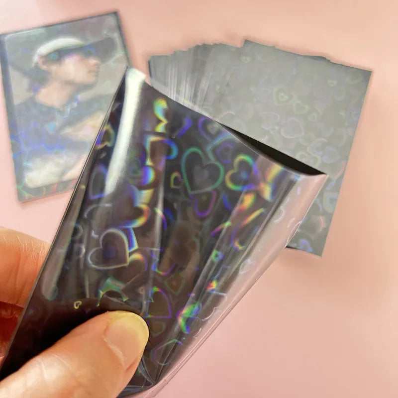 50pcs/lot 61*91mm Heart Love Laser Flashing Card Sleeves Protector For Photo Cards Holder Holographic Foil Protective Films