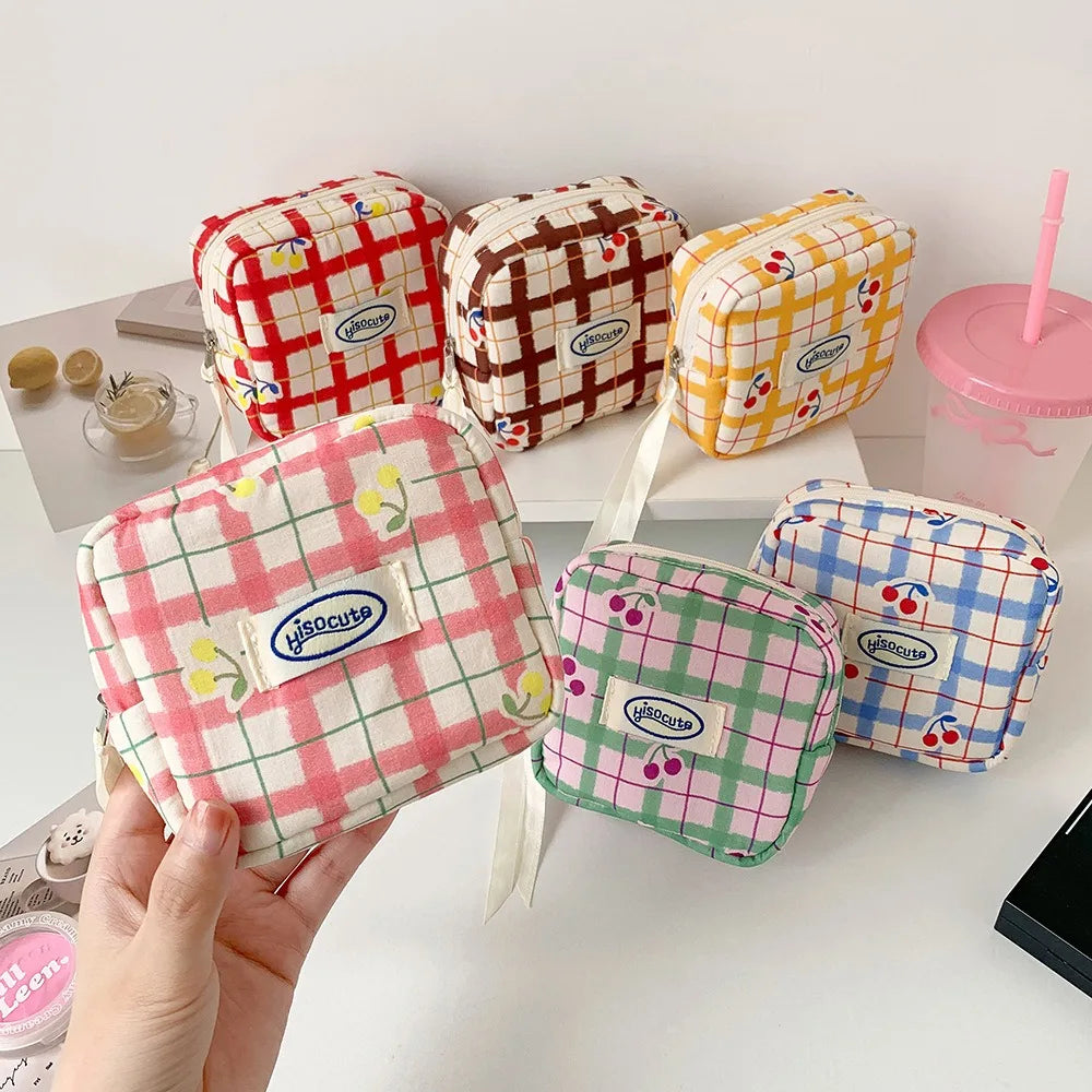 Korean version of large plaid cosmetic bag high value small cherry sanitary napkin portable mini storage bag bluetooth headset b