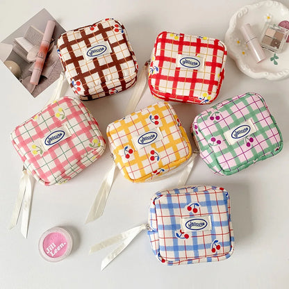 Korean version of large plaid cosmetic bag high value small cherry sanitary napkin portable mini storage bag bluetooth headset b