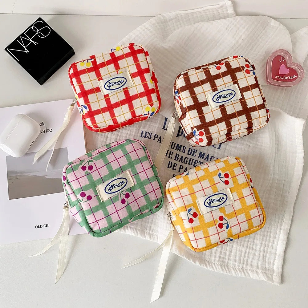 Korean version of large plaid cosmetic bag high value small cherry sanitary napkin portable mini storage bag bluetooth headset b