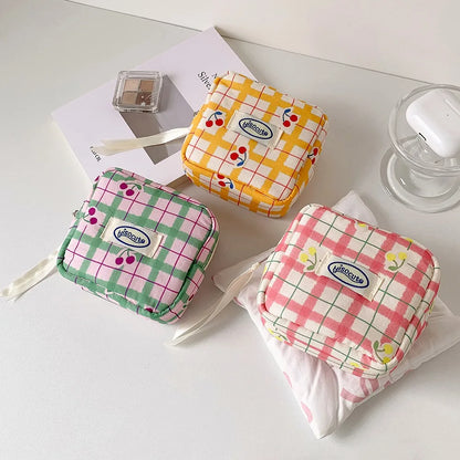 Korean version of large plaid cosmetic bag high value small cherry sanitary napkin portable mini storage bag bluetooth headset b