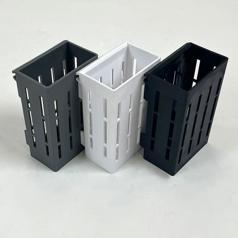 A black plant support with clips for holding aquatic plants in fish tanks